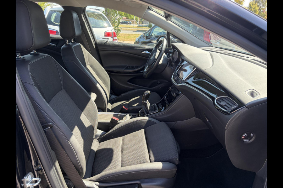 Opel Astra Sports Tourer 1.4 Business Executive 2e Eigenaar l 150pk l Carplay l Navi l Pdc V+A l Stoelvw-Stuurverw l Clima l Cruise l 18''Lmv l Halfleder l 6 Bak l Rijstrooksensor l N.A.P l Apk tot 08-2027