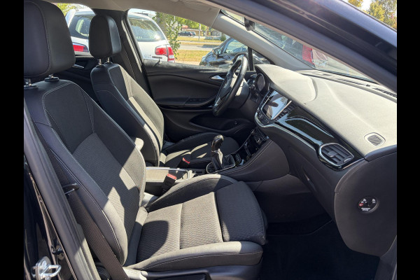 Opel Astra Sports Tourer 1.4 Business Executive 2e Eigenaar l 150pk l Carplay l Navi l Pdc V+A l Stoelvw-Stuurverw l Clima l Cruise l 18''Lmv l Halfleder l 6 Bak l Rijstrooksensor l N.A.P l Apk tot 08-2027