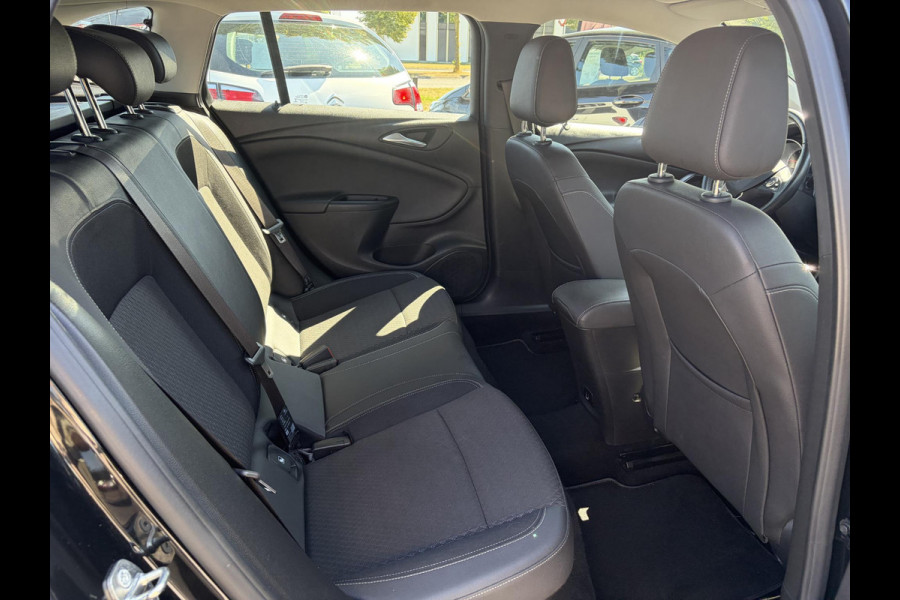 Opel Astra Sports Tourer 1.4 Business Executive 2e Eigenaar l 150pk l Carplay l Navi l Pdc V+A l Stoelvw-Stuurverw l Clima l Cruise l 18''Lmv l Halfleder l 6 Bak l Rijstrooksensor l N.A.P l Apk tot 08-2027