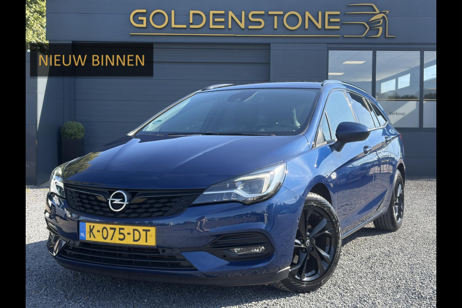 Opel Astra Sports Tourer 1.2 Ultimate 2e Eigenaar l Trekhaak l Camera l Carplay l Navi l Alcantara-Leder l 17''Lmv l Stoelverw-Stuurverw l Net beurt gehad l Dodehoek l Rijstrooksensor l Pdc V+A l 6 Bak l N.A.P l 146pk l Bj 11-2020 l Apk tot 08-2028
