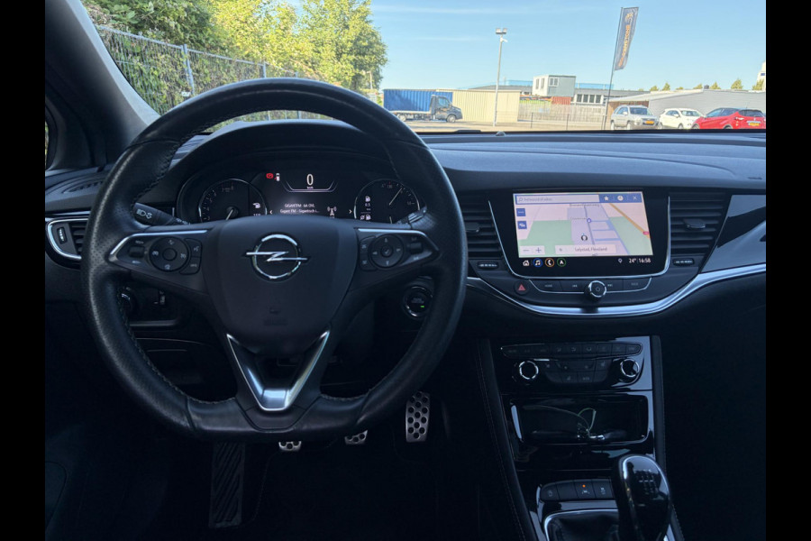 Opel Astra Sports Tourer 1.2 Ultimate 2e Eigenaar l Trekhaak l Camera l Carplay l Navi l Alcantara-Leder l 17''Lmv l Stoelverw-Stuurverw l Net beurt gehad l Dodehoek l Rijstrooksensor l Pdc V+A l 6 Bak l N.A.P l 146pk l Bj 11-2020 l Apk tot 08-2028