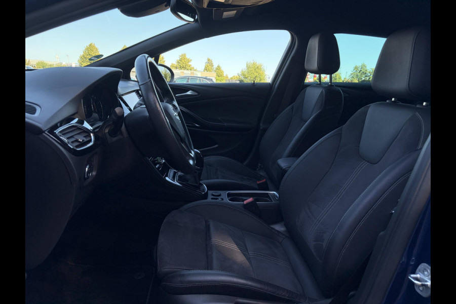 Opel Astra Sports Tourer 1.2 Ultimate 2e Eigenaar l Trekhaak l Camera l Carplay l Navi l Alcantara-Leder l 17''Lmv l Stoelverw-Stuurverw l Net beurt gehad l Dodehoek l Rijstrooksensor l Pdc V+A l 6 Bak l N.A.P l 146pk l Bj 11-2020 l Apk tot 08-2028