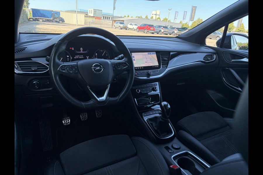 Opel Astra Sports Tourer 1.2 Ultimate 2e Eigenaar l Trekhaak l Camera l Carplay l Navi l Alcantara-Leder l 17''Lmv l Stoelverw-Stuurverw l Net beurt gehad l Dodehoek l Rijstrooksensor l Pdc V+A l 6 Bak l N.A.P l 146pk l Bj 11-2020 l Apk tot 08-2028