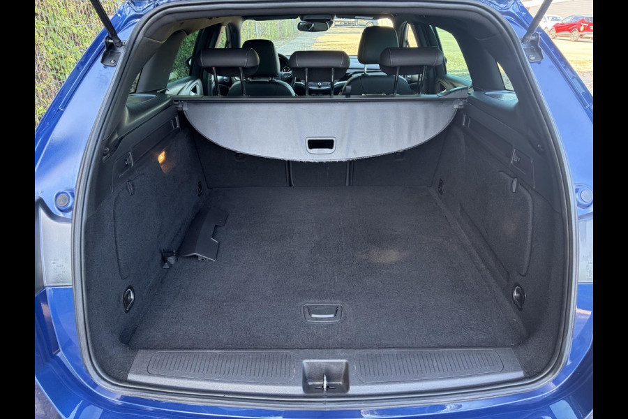 Opel Astra Sports Tourer 1.2 Ultimate 2e Eigenaar l Trekhaak l Camera l Carplay l Navi l Alcantara-Leder l 17''Lmv l Stoelverw-Stuurverw l Net beurt gehad l Dodehoek l Rijstrooksensor l Pdc V+A l 6 Bak l N.A.P l 146pk l Bj 11-2020 l Apk tot 08-2028