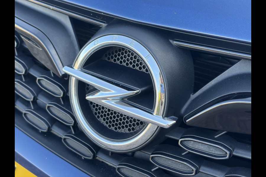 Opel Astra Sports Tourer 1.2 Ultimate 2e Eigenaar l Trekhaak l Camera l Carplay l Navi l Alcantara-Leder l 17''Lmv l Stoelverw-Stuurverw l Net beurt gehad l Dodehoek l Rijstrooksensor l Pdc V+A l 6 Bak l N.A.P l 146pk l Bj 11-2020 l Apk tot 08-2028