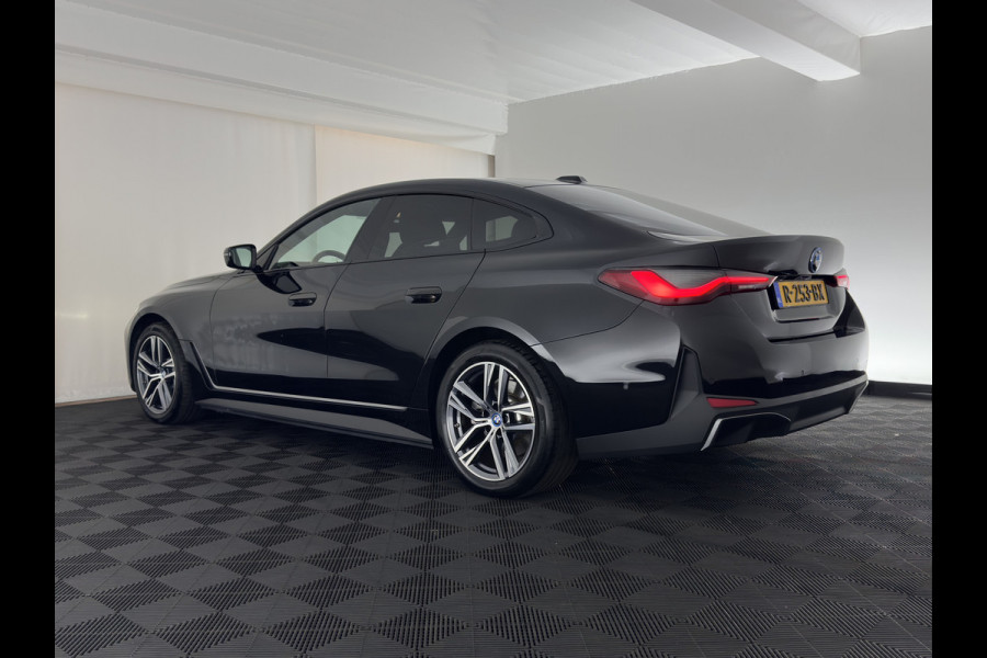 BMW i4 eDrive40 High Executive 84 kWh [3-Fase-11kW] {SoH-98%} (INCL.BTW) *PANO | HEAD-UP | LEATHER | LASER-LED | HARMAN/KARDON | HEATED-SPORTSEATS | WIDESCREEN-DIGI-COCKPIT | CAMERA | DAB+ | PRIVACY-GLASS | NAVI-FULLMAP | ECC | PDC | 18''ALU*