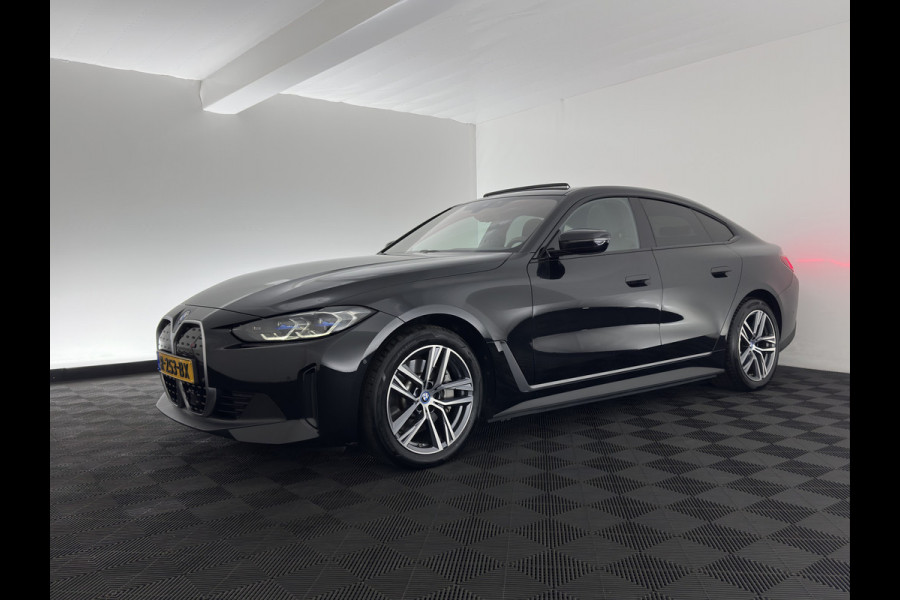 BMW i4 eDrive40 High Executive 84 kWh [3-Fase-11kW] {SoH-98%} (INCL.BTW) *PANO | HEAD-UP | LEATHER | LASER-LED | HARMAN/KARDON | HEATED-SPORTSEATS | WIDESCREEN-DIGI-COCKPIT | CAMERA | DAB+ | PRIVACY-GLASS | NAVI-FULLMAP | ECC | PDC | 18''ALU*