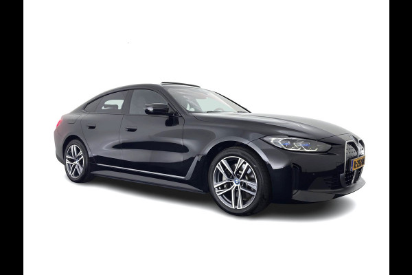 BMW i4 eDrive40 High Executive 84 kWh [3-Fase-11kW] {SoH-98%} (INCL.BTW) *PANO | HEAD-UP | LEATHER | LASER-LED | HARMAN/KARDON | HEATED-SPORTSEATS | WIDESCREEN-DIGI-COCKPIT | CAMERA | DAB+ | PRIVACY-GLASS | NAVI-FULLMAP | ECC | PDC | 18''ALU*