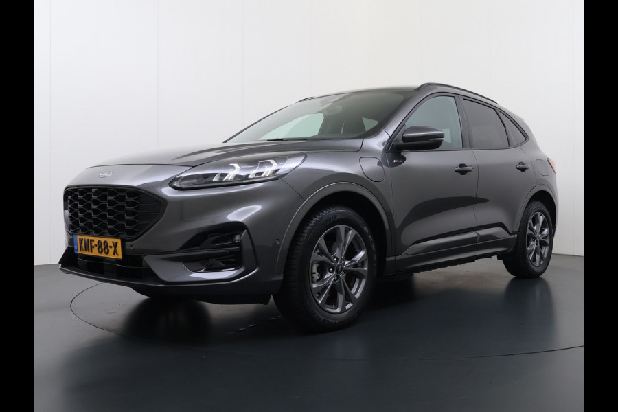 Ford Kuga 2.5 PHEV Hybrid ST-Line Adap.Cruise Stoel+Stuur+Voorruit+Achterbankverwarming Head-Up Display Camera Navi Elek.Achterklep Apple  Digital Cockpit Lane Assist Privacy Glas Lmv Pdc Led Bluetooth Isofix DAB Keyless