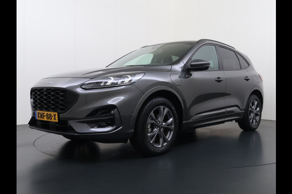 Ford Kuga 2.5 PHEV Hybrid ST-Line Adap.Cruise Stoel+Stuur+Voorruit+Achterbankverwarming Head-Up Display Camera Navi Elek.Achterklep Apple  Digital Cockpit Lane Assist Privacy Glas Lmv Pdc Led Bluetooth Isofix DAB Keyless