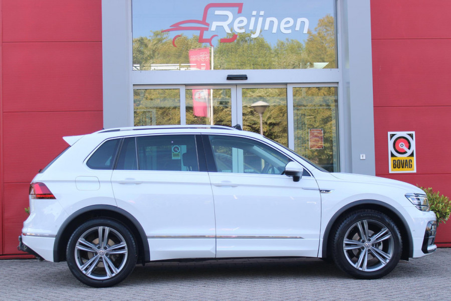 Volkswagen Tiguan 1.5 TSI 150PK AUTOMAAT HIGHLINE BUSINESS R | PANORAMA SCHUIF/KANTEL DAK | LEDEREN BEKLEDING | BESTUUDERSSTOEL ELEKTRISCH VERSTELBAAR MET GEHEUGENFUNCTIE | ELEKTRISCH WEGKLAPBARE TREKHAAK | IQ LIGHT KOPLAMPEN | VIRTUAL DISPLAY | DRAADLOZE APPLE CARPLAY/ANDROID AUTO | NAVIGATIE | 19" LICHTMETALEN VELGEN | ELEKTRISCH BEDIENBARE ACHTERKLEP | GETINTE ACHTERRUITEN | CAMERA VOOR + ACHTER | PARKEERSENSOREN VOOR + ACHTER | STOEL VERWARMING |