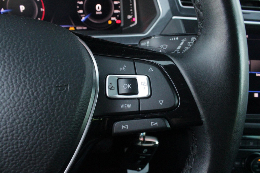 Volkswagen Tiguan 1.5 TSI 150PK AUTOMAAT HIGHLINE BUSINESS R | PANORAMA SCHUIF/KANTEL DAK | LEDEREN BEKLEDING | BESTUUDERSSTOEL ELEKTRISCH VERSTELBAAR MET GEHEUGENFUNCTIE | ELEKTRISCH WEGKLAPBARE TREKHAAK | IQ LIGHT KOPLAMPEN | VIRTUAL DISPLAY | DRAADLOZE APPLE CARPLAY/ANDROID AUTO | NAVIGATIE | 19" LICHTMETALEN VELGEN | ELEKTRISCH BEDIENBARE ACHTERKLEP | GETINTE ACHTERRUITEN | CAMERA VOOR + ACHTER | PARKEERSENSOREN VOOR + ACHTER | STOEL VERWARMING |