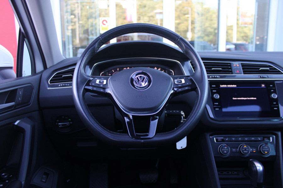 Volkswagen Tiguan 1.5 TSI 150PK AUTOMAAT HIGHLINE BUSINESS R | PANORAMA SCHUIF/KANTEL DAK | LEDEREN BEKLEDING | BESTUUDERSSTOEL ELEKTRISCH VERSTELBAAR MET GEHEUGENFUNCTIE | ELEKTRISCH WEGKLAPBARE TREKHAAK | IQ LIGHT KOPLAMPEN | VIRTUAL DISPLAY | DRAADLOZE APPLE CARPLAY/ANDROID AUTO | NAVIGATIE | 19" LICHTMETALEN VELGEN | ELEKTRISCH BEDIENBARE ACHTERKLEP | GETINTE ACHTERRUITEN | CAMERA VOOR + ACHTER | PARKEERSENSOREN VOOR + ACHTER | STOEL VERWARMING |