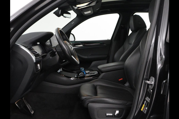BMW iX3 Executive 80 kWh | SOH 93,8% | Panoramadak | Leder | Stoelverwarming | Adaptive cruise | Carplay | Sfeerverlichting | Camera | Park assist | Elektrische achterklep | PHEV