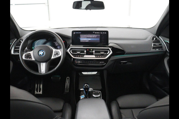 BMW iX3 Executive 80 kWh | SOH 93,8% | Panoramadak | Leder | Stoelverwarming | Adaptive cruise | Carplay | Sfeerverlichting | Camera | Park assist | Elektrische achterklep | PHEV
