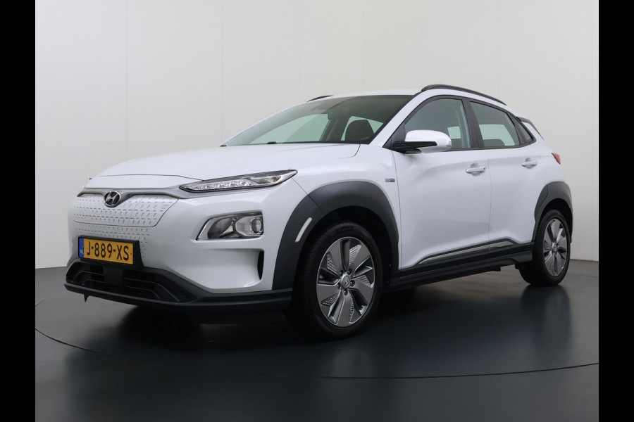Hyundai Kona EV Comfort 64kWh 3-Fase Laden Warmtepomp Adap.Cruise SOH 100% Camera Navi* Apple Carplay Android Auto Ecc Pdc Keyless Lane Assist Bluetooth DAB Led FCA Origineel Nederlandse Auto