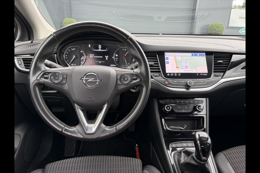 Opel Astra 1.2 Business Elegance 2e Eigenaar l Navi l Camera l Carplay l Keyless l Trekhaak l 110pk l Pdc V+A l Halfleder l 6 Bak l N.A.P l | Lm velgen l Rijstrooksensor l Apk tot 07-2027