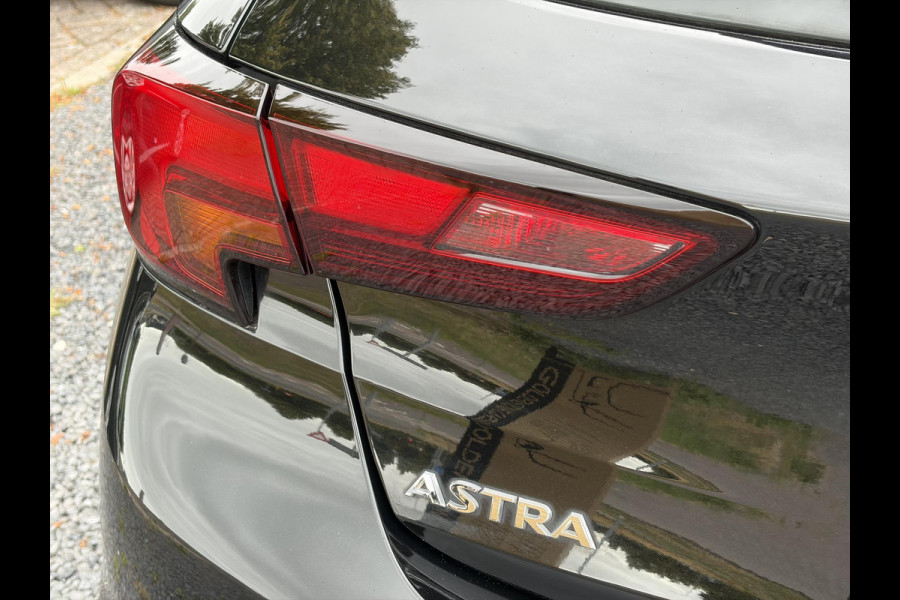 Opel Astra 1.2 Business Elegance 2e Eigenaar l Navi l Camera l Carplay l Keyless l Trekhaak l 110pk l Pdc V+A l Halfleder l 6 Bak l N.A.P l | Lm velgen l Rijstrooksensor l Apk tot 07-2027