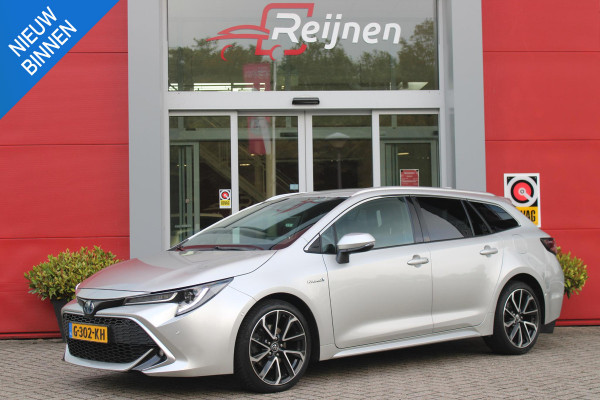 Toyota Corolla Touring Sports 2.0 Hybrid 180PK AUTOMAAT EXECUTIVE JBL | STOEL VERWARMING | DODEHOEK DETECTIE | NAVIGATIE | APPLE CARPLAY/ANDROID AUTO | CLIMATE CONTROL | ADAPTIVE CRUISE CONTROL | FULL LED KOPLAMPEN | KEYLESS ENTRY/START | ALL SEASON BANDEN | 18" LICHTMETALEN VELGEN | DAB+ RADIO | JBL AUDIO SSTEM | ELEKTRISCH BEDIENBARE ACHTERKLEP | ACHTERUITRIJ CAMERA | PARKEERSENSOREN VOOR + ACHTER | DRAADLOZE TELEFOONLADER | HEAD UP DISPLAY |