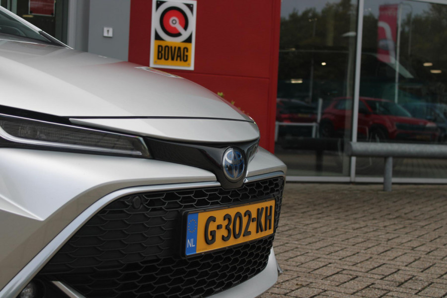 Toyota Corolla Touring Sports 2.0 Hybrid 180PK AUTOMAAT EXECUTIVE JBL | STOEL VERWARMING | DODEHOEK DETECTIE | NAVIGATIE | APPLE CARPLAY/ANDROID AUTO | CLIMATE CONTROL | ADAPTIVE CRUISE CONTROL | FULL LED KOPLAMPEN | KEYLESS ENTRY/START | ALL SEASON BANDEN | 18" LICHTMETALEN VELGEN | DAB+ RADIO | JBL AUDIO SSTEM | ELEKTRISCH BEDIENBARE ACHTERKLEP | ACHTERUITRIJ CAMERA | PARKEERSENSOREN VOOR + ACHTER | DRAADLOZE TELEFOONLADER | HEAD UP DISPLAY |