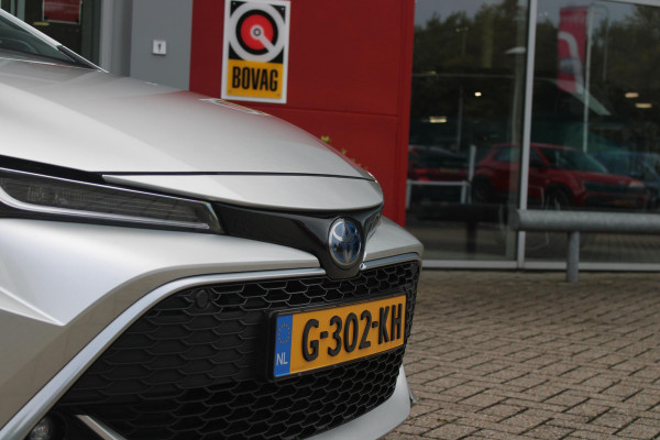 Toyota Corolla Touring Sports 2.0 Hybrid 180PK AUTOMAAT EXECUTIVE JBL | STOEL VERWARMING | DODEHOEK DETECTIE | NAVIGATIE | APPLE CARPLAY/ANDROID AUTO | CLIMATE CONTROL | ADAPTIVE CRUISE CONTROL | FULL LED KOPLAMPEN | KEYLESS ENTRY/START | ALL SEASON BANDEN | 18" LICHTMETALEN VELGEN | DAB+ RADIO | JBL AUDIO SSTEM | ELEKTRISCH BEDIENBARE ACHTERKLEP | ACHTERUITRIJ CAMERA | PARKEERSENSOREN VOOR + ACHTER | DRAADLOZE TELEFOONLADER | HEAD UP DISPLAY |