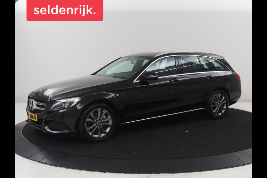 Mercedes-Benz C-Klasse Estate 180 Business Solution | Half leder | Stoelverwarming | Navigatie | Bluetooth | Camera | Park assist | Cruise control | Climate control | Elektrische achterklep | Trekhaak