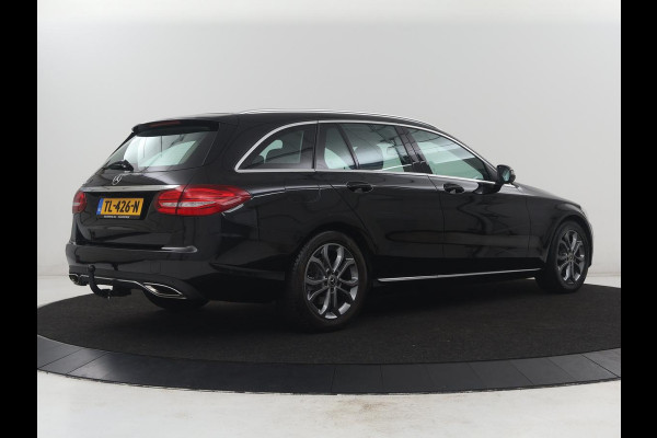 Mercedes-Benz C-Klasse Estate 180 Business Solution | Half leder | Stoelverwarming | Navigatie | Bluetooth | Camera | Park assist | Cruise control | Climate control | Elektrische achterklep | Trekhaak