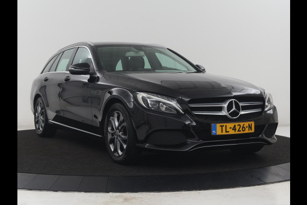 Mercedes-Benz C-Klasse Estate 180 Business Solution | Half leder | Stoelverwarming | Navigatie | Bluetooth | Camera | Park assist | Cruise control | Climate control | Elektrische achterklep | Trekhaak