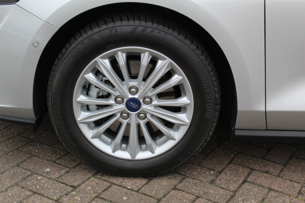Ford FOCUS Wagon 1.0-125pk EcoBoost Mild-hybrid Titanium. Mooie, ruime, luxe en comfortabele Ford Focus wagon. Volautm. airco dual, camera, easy entry/easy go, stoel-, stuur- en voorraamverw., cruise control, Isofix, side- en lane assist, parkeersensoren v+a, LM wielen etc.