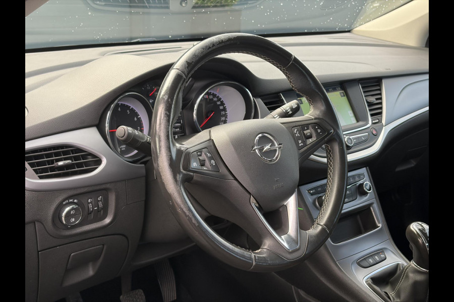 Opel Astra 1.2 Business Edition 147pk l 2e Eigenaar l Trekhaak l Navi l Carplay l 6 Bak l Clima l Cruise l Pdc V+A l Recent beurt gehad l Lm velgen l N.A.P l Apk tot 07-2028