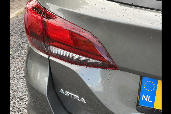 Opel Astra 1.2 Business Edition 147pk l 2e Eigenaar l Trekhaak l Navi l Carplay l 6 Bak l Clima l Cruise l Pdc V+A l Recent beurt gehad l Lm velgen l N.A.P l Apk tot 07-2028