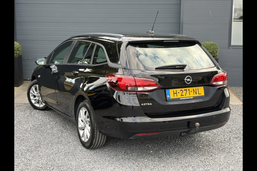 Opel Astra Sports Tourer 1.2 Edition ✓2e Eigenaar✓Trekhaak✓131pk✓Navi✓Airco✓Cruise✓Pdc V+A✓Lm velgen✓Dealer Onderhouden✓Comfortstoelen✓N.A.P✓Apk tot 07-2028