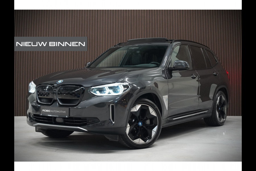 BMW iX3 High Executive 80 kWh | Panoramadak | Harman Kardon | Stoelverwarming | Adaptive Cruise Control | Head-Up Display | Memory Seat | 360 Camera | Ambiance Verlichting | Adaptief Onderstel | Adaptive LED | Trekhaak |