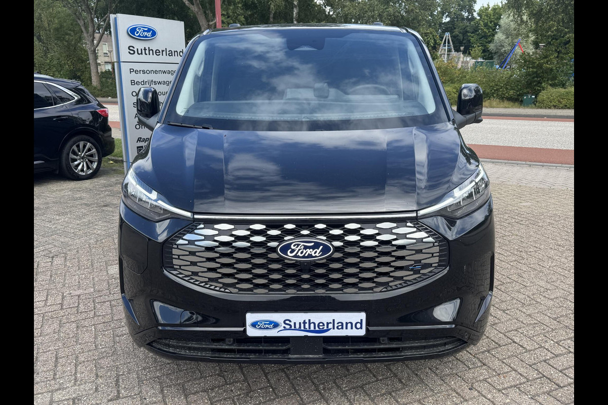 Ford E-Transit Custom 340 L2H1 Limited 71 kWh | SCI | 218pk | Laadvloer bescherming | 12-weg verstel- en verwarmbare AGR bestuurders- en passagiersstoel Laadvloer bescherming,12-weg verstel- en verwarmbare AGR bestuurders- en passagiersstoel | Trekhaakvoorbereiding | 17 inch lichtmetalen velgen (Carbonised Grey) | Driver Assistent Pack Ultimate | AGM accu | BEV 3-fase oplaadkabel (mode 3, 32A, 10m)