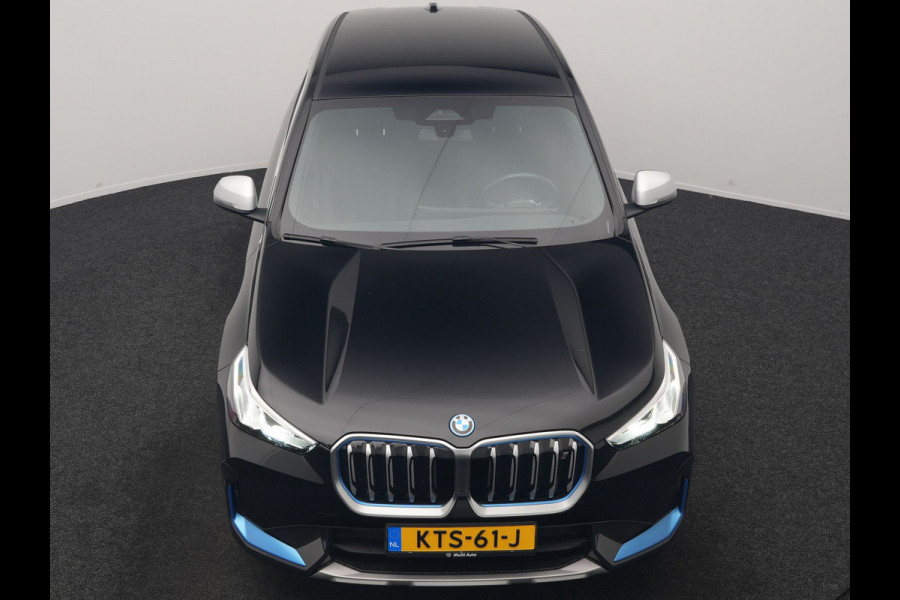 BMW iX1 xDrive30 X Line 67 kWh 313pk Dealer O.H. | Trekhaak Af Fabriek | Adaptive Cruise | Lederen Sportstoelen Massage & Verwarmd | Camera | Adaptief M-onderstel | Blis | Sfeerverlichting | Apple Carplay | Navigatie | DAB |
