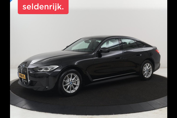 BMW i4 eDrive40 High Executive 84 kWh | SOH 98,7% | Leder | Adaptive cruise | Dodehoek detectie | Head-up | Stoelverwarming | Sfeerverlichting | Carplay | 3 zone klimaat | Camera | Park assist | Elektrische achterklep