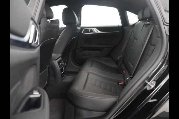 BMW i4 eDrive40 High Executive 84 kWh | SOH 98,7% | Leder | Adaptive cruise | Dodehoek detectie | Head-up | Stoelverwarming | Sfeerverlichting | Carplay | 3 zone klimaat | Camera | Park assist | Elektrische achterklep