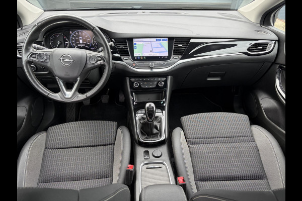 Opel Astra Sports Tourer 1.2 Elegance ✓131pk✓2e Eigenaar✓Camera✓Carplay✓6 Bak✓Stoelverw✓Stuurverw✓Pdc V+A✓Recent beurt gehad✓Clima✓Cruise✓Halfleder✓Keyless✓N.A.P✓Lm velgen✓Rijstrooksensor✓Apk tot 07-2027