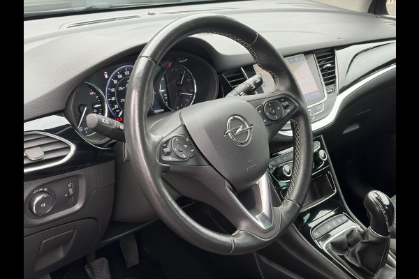 Opel Astra Sports Tourer 1.2 Elegance ✓131pk✓2e Eigenaar✓Camera✓Carplay✓6 Bak✓Stoelverw✓Stuurverw✓Pdc V+A✓Recent beurt gehad✓Clima✓Cruise✓Halfleder✓Keyless✓N.A.P✓Lm velgen✓Rijstrooksensor✓Apk tot 07-2027