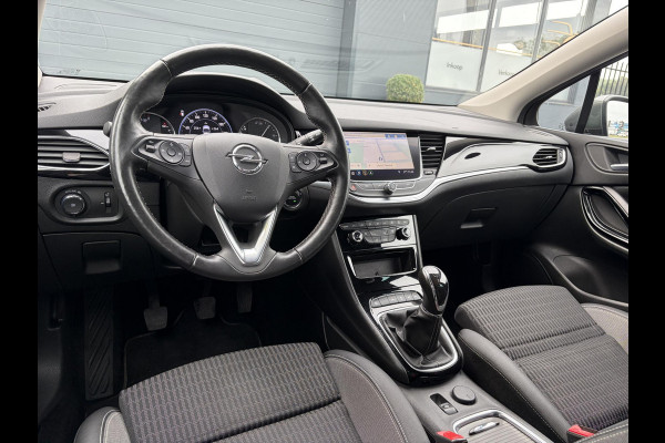 Opel Astra Sports Tourer 1.2 Elegance ✓131pk✓2e Eigenaar✓Camera✓Carplay✓6 Bak✓Stoelverw✓Stuurverw✓Pdc V+A✓Recent beurt gehad✓Clima✓Cruise✓Halfleder✓Keyless✓N.A.P✓Lm velgen✓Rijstrooksensor✓Apk tot 07-2027