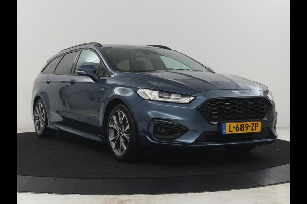 Ford Mondeo Wagon 2.0 IVCT HEV St-Line | Leder/alcantara | Memory | Cruise control | Dodehoek detectie | Stuur/stoel verwarming | Achterbank verwarming | Carplay | Camera | Park assist | Elektrische achterklep