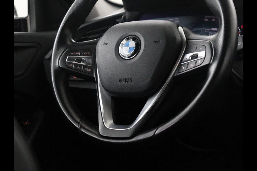 BMW 1-serie 118i Business Edition | Half leder | Cruise control | Stoelverwarming | Navigatie | Carplay | Park assist | Climate control | Virtual dashboard | 17" velgen