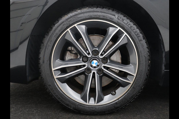 BMW 1-serie 118i Business Edition | Half leder | Cruise control | Stoelverwarming | Navigatie | Carplay | Park assist | Climate control | Virtual dashboard | 17" velgen
