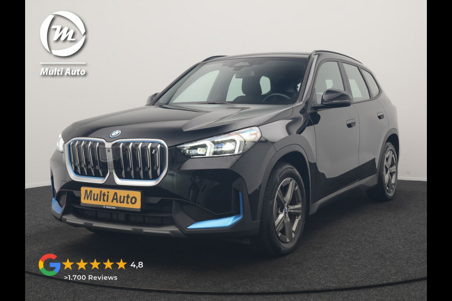 BMW iX1 xDrive30 67 kWh 313pk Dealer O.H. | Trekhaak Af Fabriek | Camera | Adaptief M Onderstel | Voorstoelen Verwarmd | Blis | Keyless | Apple Carplay | Adaptive LED | Sfeerverlichting | Widescreen Navi | DAB |