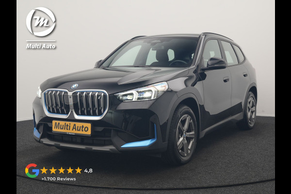 BMW iX1 xDrive30 67 kWh 313pk Dealer O.H. | Trekhaak Af Fabriek | Camera | Adaptief M Onderstel | Voorstoelen Verwarmd | Blis | Keyless | Apple Carplay | Adaptive LED | Sfeerverlichting | Widescreen Navi | DAB |