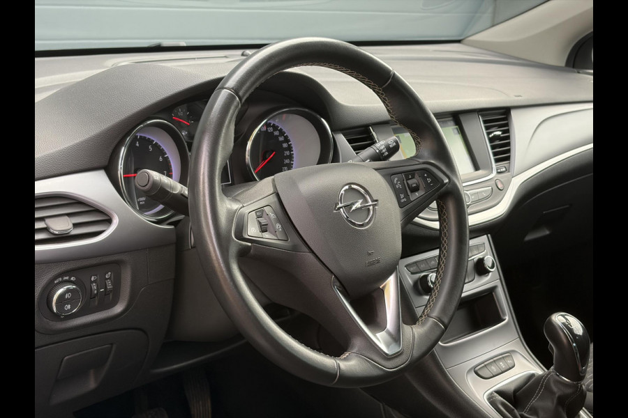 Opel Astra Sports Tourer 1.2 Business Executive ✓1e Eigenaar✓146pk✓Camera✓Trekhaak✓Carplay✓Airco✓Cruise✓Pdc V+A✓Lm velgen✓Comfortstoelen✓6 Bak✓N.A.P✓Nieuwe Apk bij Aflevering