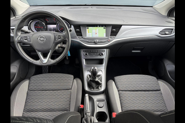 Opel Astra Sports Tourer 1.2 Business Executive ✓1e Eigenaar✓146pk✓Camera✓Trekhaak✓Carplay✓Airco✓Cruise✓Pdc V+A✓Lm velgen✓Comfortstoelen✓6 Bak✓N.A.P✓Nieuwe Apk bij Aflevering