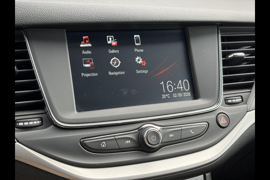 Opel Astra Sports Tourer 1.2 Business Executive ✓1e Eigenaar✓146pk✓Camera✓Trekhaak✓Carplay✓Airco✓Cruise✓Pdc V+A✓Lm velgen✓Comfortstoelen✓6 Bak✓N.A.P✓Nieuwe Apk bij Aflevering