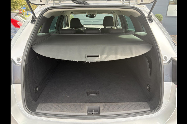 Opel Astra Sports Tourer 1.2 Business Executive ✓1e Eigenaar✓146pk✓Camera✓Trekhaak✓Carplay✓Airco✓Cruise✓Pdc V+A✓Lm velgen✓Comfortstoelen✓6 Bak✓N.A.P✓Nieuwe Apk bij Aflevering