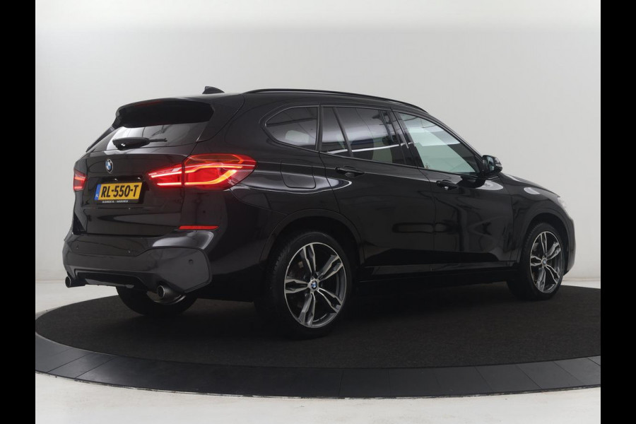 BMW X1 sDrive20i High Executive M-sport | Leder | Memory | Harman/Kardon | Head-up | Cruise control | Stoelverwarming | Climate control | Navigatie | Bluetooth | Park assist | Elektrische achterklep